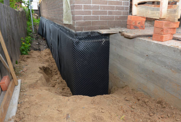 SJ Waterproofing Pros technician performing targeted Waterproofing assessment in Harrodsburg, KY